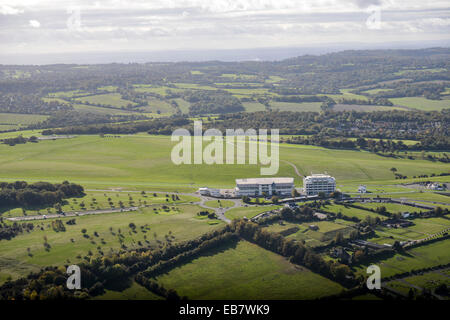 An aerial view of Epsom Downs racecourse and the countryside beyond.