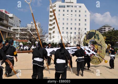 Okinawan man in traditional costume Ryukyu Mura, historical village ...
