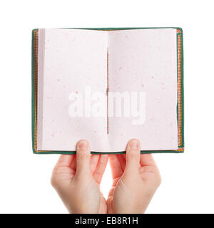 Opened book in hands isolated on white background Stock Photo