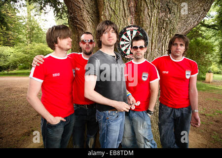 Embrace (English band) playing darts outside in Kemble , Gloucestershire, England, United Kingdom. Stock Photo