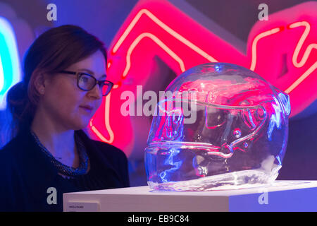 Glass helmet of a Formula 1 driver with neon signs of Formula 1 circuits. Angela Palmer's solo exhibition 'Adrenalin', Fine Art Stock Photo