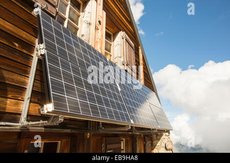 Solar panels on the Cabanne D' Orny in the Swiss Alps, providing electricty for this off grid mountain hut at over 10,000 feet. Stock Photo