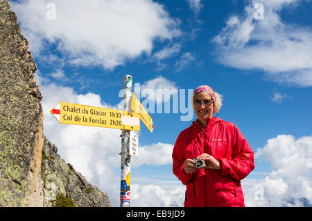 The Fenetre D' Arpette at 2665M in the Swiss alps on the Tour Du Mont Blanc, with a walker doing the Tour Du Mont Blanc. Stock Photo