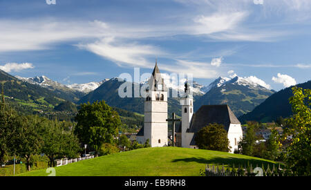 Townscape in front of Kitzbühel Alps, Parish Church of St. Andrew and Church of Our Lady, Kitzbühel, Tyrol, Austria Stock Photo