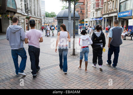 Group of teenagers walking down the street together, Stock Photo