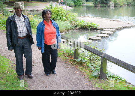 Older couple walking in the park together, Stock Photo