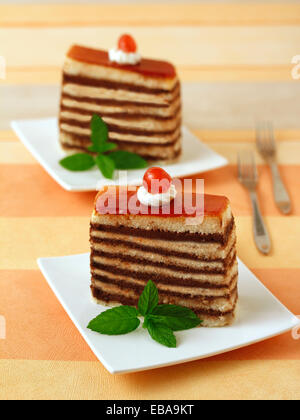 Layered sponge cake with cherries. Recipe available. Stock Photo