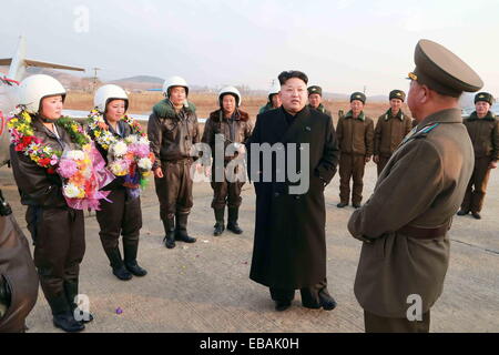 Pyongyang, North Korea. 28th Nov, 2014. Photo provided by Korean Central News Agency (KCNA) on Nov. 28, 2014 shows top leader of the Democratic People's Republic of Korea (DPRK) Kim Jong Un (C) guiding a flight drill. Kim Jong Un gave field guidance to the flight drill of female pilots of the Korean People's Army (KPA) Air and Anti-Air Force in a recent visit. Credit:  Xinhua/Alamy Live News Stock Photo
