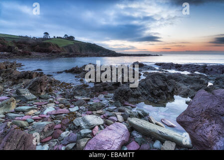 Sunrise at Talland Bay a small cove between Looe and Polperro in Cornwall Stock Photo