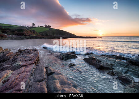 Sunrise over Talland Bay in Cornwall Stock Photo