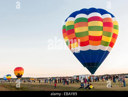 Queesbury, New York, USA - September 20, 2013: The crowds watch how the hot air balloons are inflated before flight Stock Photo