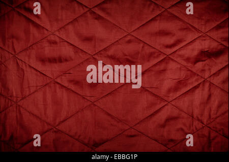 Red quilted material texture Stock Photo