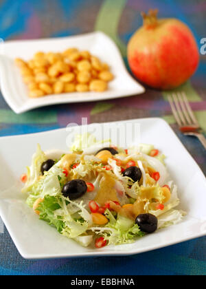Salad with pomegranates and lupins. Recipe available. Stock Photo