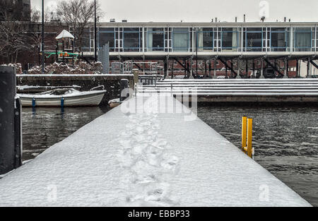 Pier in Amsterdam Harbor with snow Stock Photo