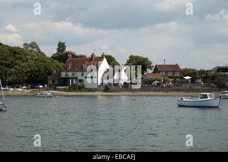 Dell Quay, Birdham Cnannel, Chichester Harbour, West Sussex, England. Showing the Crown & Anchor pub/inn. Stock Photo