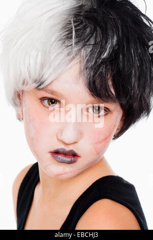 Portrait of a Young Girl in Wig and Scary Makeup Stock Photo