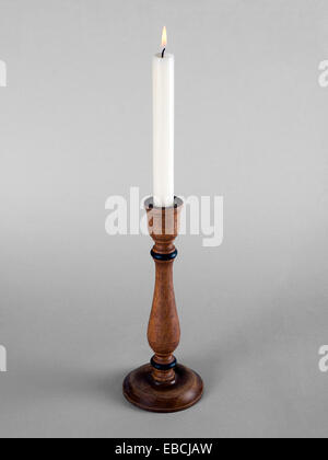 Wooden candlestick with white candle Stock Photo