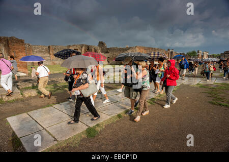 Rainbow and tourists at the Forum in Pompeii Stock Photo