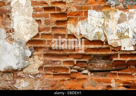 Texture of old brick with chipped plaster Stock Photo