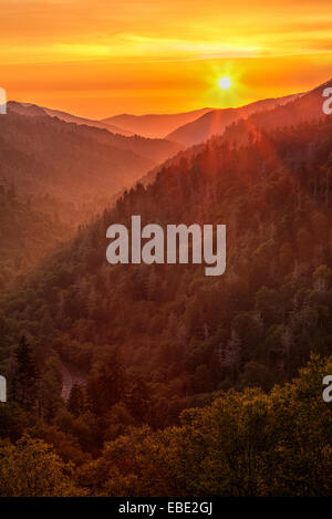 The sun setting over mountains as seen from the Morton Overlook in the Great Smoky Mountains National Park. Stock Photo