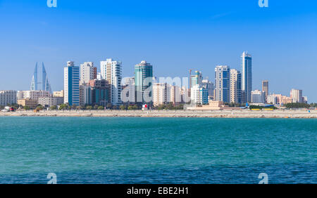 Modern office buildings and hotels in the sunny day. Skyline of Manama city, Bahrain Stock Photo