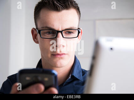 Young Man Working in Office, Mannheim, Baden, Wurttemberg, Germany Stock Photo
