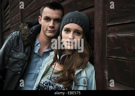 Close-up portrait of teenage girl and young man outdoors, looking at camera, Germany Stock Photo