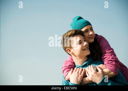 Close-up portrait of teenage couple embracing outdoors, Germany Stock Photo