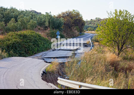 Because of the violation of technology in the construction of roads, water washed away roads and formed a failure Stock Photo