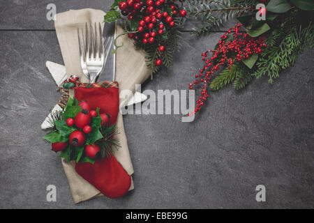 Holiday place setting. Christmas stocking place settings with festive decorations Stock Photo