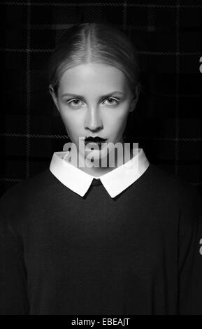 Studio Portrait of Strict Woman with White Collar Stock Photo