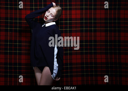 Elegant Woman over Checkered Geometric Background Stock Photo