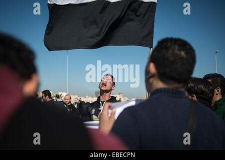 Cairo, Egypt. 29th Nov, 2014. An anti-Mubarak protester shouts slogan outside a court in Cairo, Egypt, Nov. 29, 2014. A Cairo criminal court dismissed murder charges against Egypt's former president Hosni Mubarak and acquitted five of his security aides on Saturday. Credit:  Pan Chaoyue/Xinhua/Alamy Live News Stock Photo