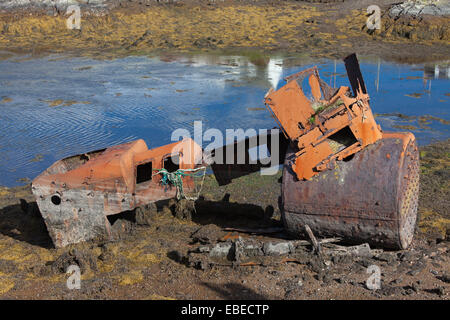 Rusty boiler on the shoreline in Isle of Scalpay, near Harris, Scotland. Stock Photo