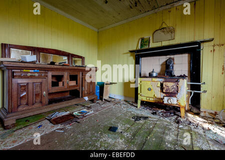 Abandoned dwelling at Lingreabhagh, Isle of Harris, Outer Hebrides, Scotland. There is furniture and a range cooker abandoned. Stock Photo