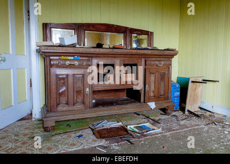 Abandoned dwelling at Lingreabhagh, Isle of Harris, Outer Hebrides, Scotland. There is a solid wood piece of furniture left. Stock Photo