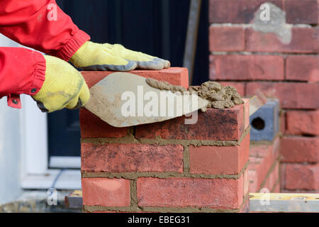 Man bricklaying - making gate post Stock Photo