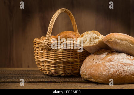 assortment of bread, baking products on wooden table Stock Photo