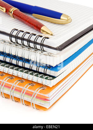 Notepad and pens isolated on white background Stock Photo - Alamy