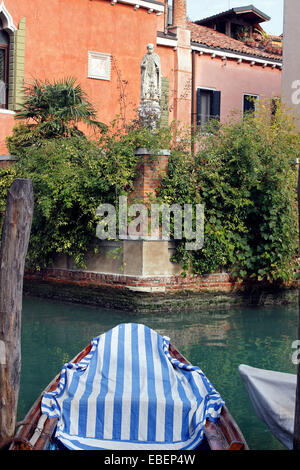 Venice Italy Dorsoduro religious statue along a canal Stock Photo