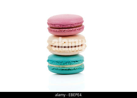 Three multicolored stacked macaroons isolated on white background Stock Photo