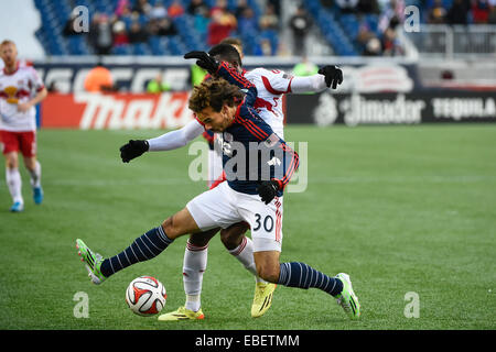 Foxborough, Massachusetts, USA. 29th Nov, 2014. New England Revolution defender Kevin Alston (30) and New York Red Bulls midfielder Lloyd Sam (10) battle for the ball during the MLS Eastern Conference Championship match between the New York Red Bulls and New England Revolution held at Gillette Stadium in Foxborough Massachusetts. Credit:  Cal Sport Media/Alamy Live News Stock Photo