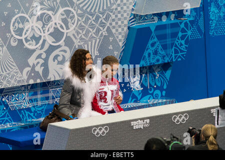 Yulia Lipnitskaya (RUS) and her coach Eteri Tutberidze in the kiss and cry area after competiting in the Women's Figure Skating Stock Photo