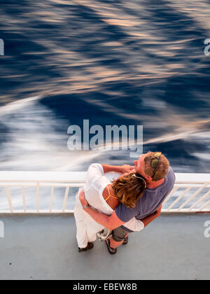 Couple embracing each other in a boat trip Stock Photo