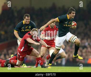 Cardiff, UK. 29th Nov, 2014. Samson Lee of Wales fails to hold Eben Etzebeth of South Africa - Autumn Internationals - Wales vs South Africa - Millennium Stadium - Cardiff - Wales - 29th November 2014 - Picture Simon Bellis/Sportimage. Credit:  csm/Alamy Live News Stock Photo