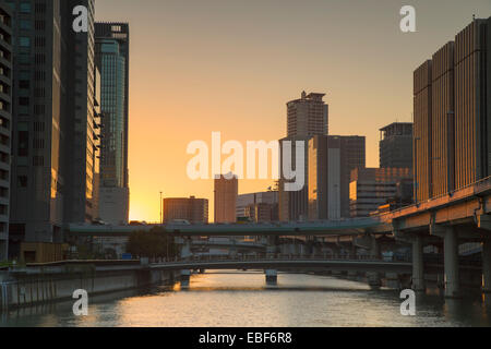 Skyscrapers on Nakanoshima island at sunset, Kita, Osaka, Kansai, Japan Stock Photo