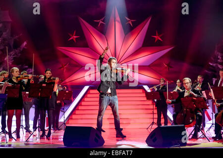 Suhl, Germany. 29th Nov, 2014. Violinist David Garrett performs during the 'Adventsfest der 100000 Lichter' (Advent Fest of the 100000 Lights' in the Congress Center in Suhl, Germany, 29 November 2014. The music program was broadcast live on ARD. Photo: ANDREAS LANDER/dpa/Alamy Live News Stock Photo