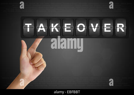 hand clicking takeover on Flip Board Display Stock Photo