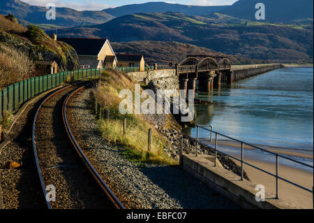 The rail and footbridge over the Mawddach estuary Barmouth Snowdonia Gwynedd North Wales Stock Photo