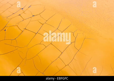 cracked peeling yellow paint texture layer Stock Photo